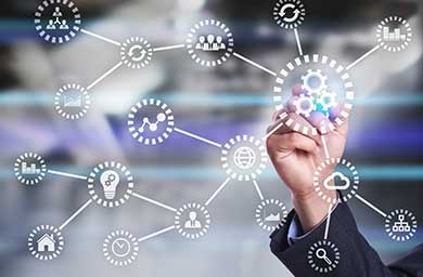 Graphic of innovation icons linked together highlighted by a business person's hand